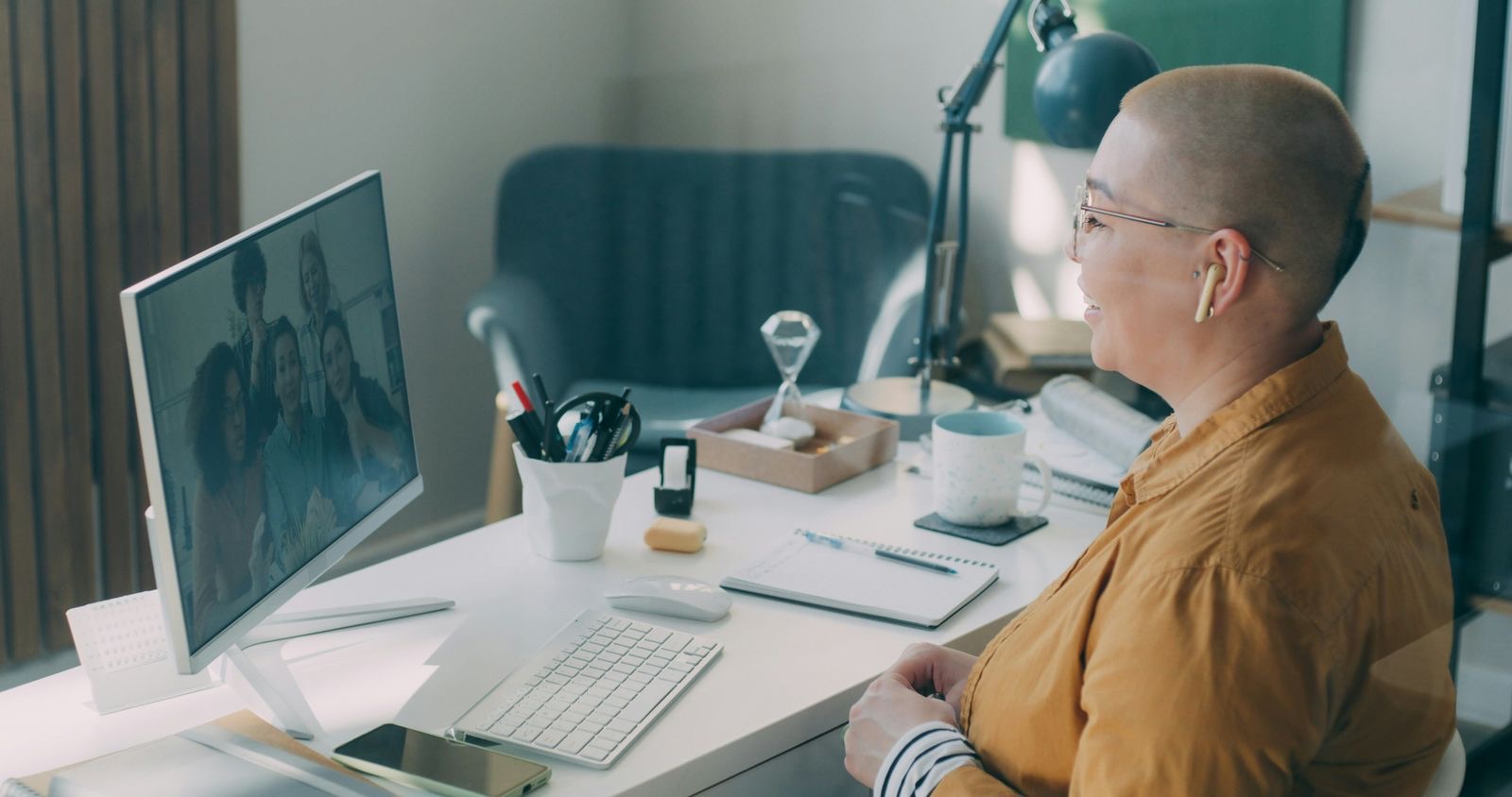 A woman meeting her psychiatrist on a video call from home