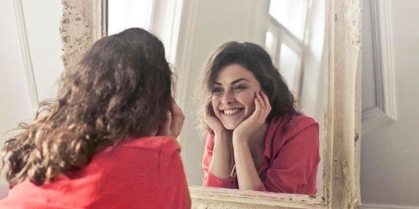 smiling on mirror